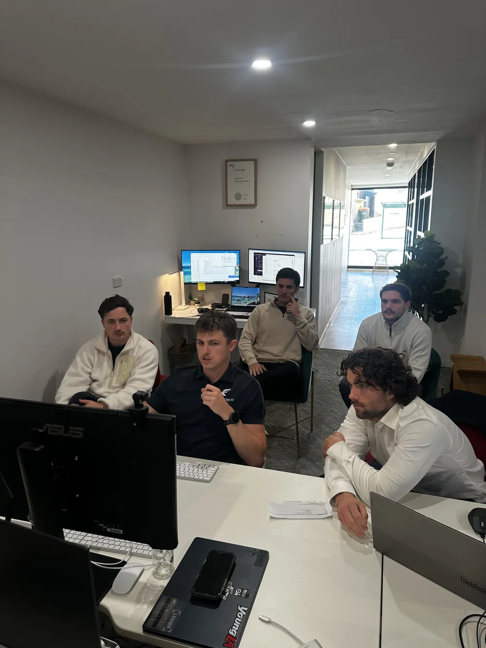 The Intraflow AI team at work in the office